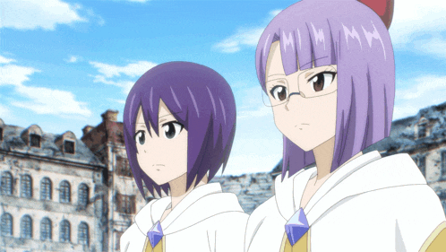 two girls with purple hair are standing next to each other and one has the letter m on her hair