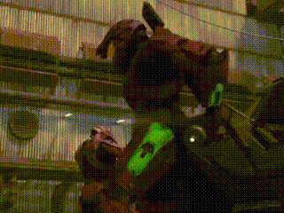 a purple robot with a green stripe on its chest