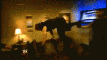 a blurry picture of a wrestling show with a w logo