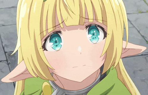 a close up of a girl with blonde hair and green eyes