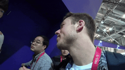 a man wears a lanyard that says g-star on it
