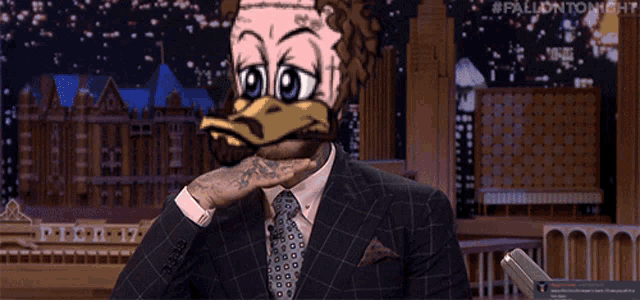 a man in a suit and tie with a duck face on his face