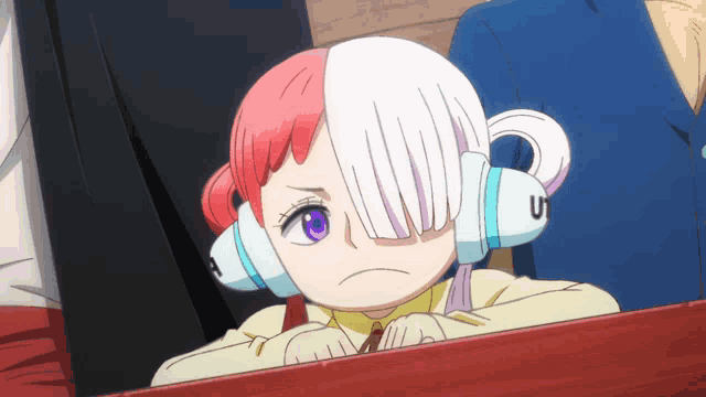 a cartoon character with a purple eye and a u on her ears