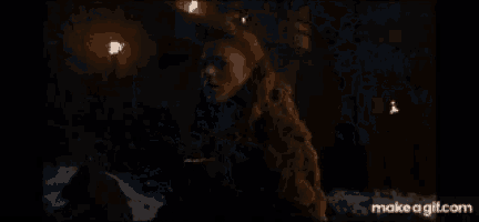 a close up of a man 's face with make a gif.com at the bottom of the screen