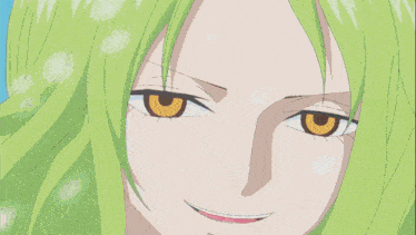 a man with green hair is smiling in front of a snowy landscape