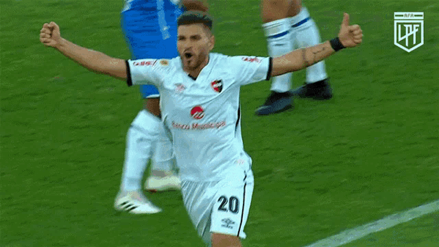 a soccer player wearing a white jersey with the word municipal on the front
