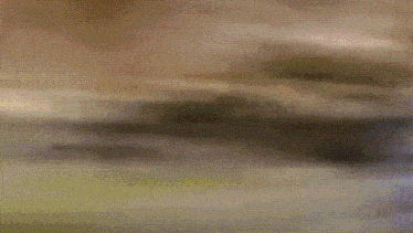 a blurred image of a bottle of water on a table