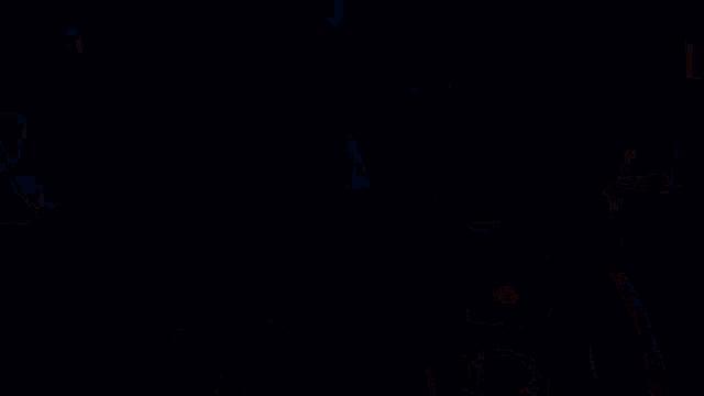 a group of lego characters are standing next to each other in a cave holding torches .