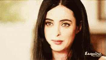 a close up of a woman 's face with the words esquire network written on the bottom .