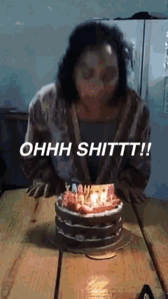 a woman blowing out candles on a birthday cake with the words ohhh shittt written below her