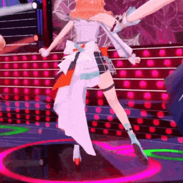 a girl in a white dress is dancing on a stage in front of a crowd of people .