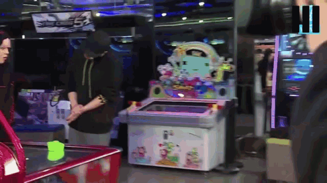 a man stands in front of a machine that says ' bubbles ' on it
