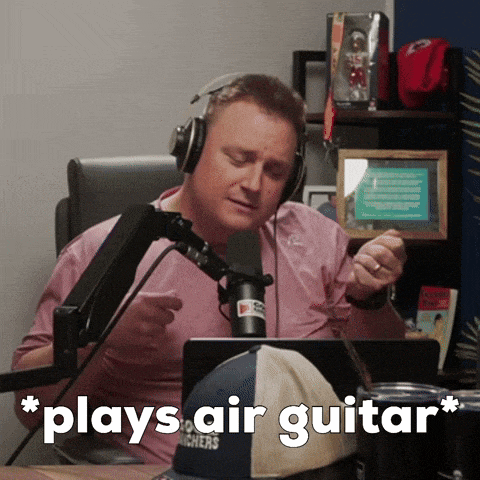 a man playing a guitar in front of a microphone with the words " plays air guitar " on the bottom