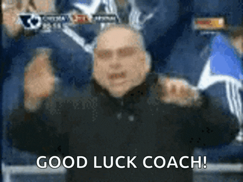 a blurry picture of a man with the words good luck coach on the bottom