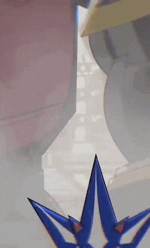 a close up of a cartoon character with a blue star on his head