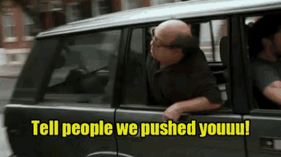 a man in a car with the words tell people we pushed youuu written on it