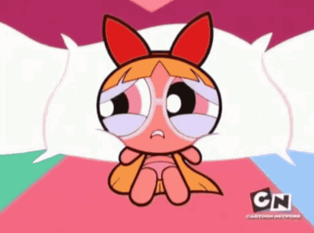a cartoon character from the cartoon network sits on a bed