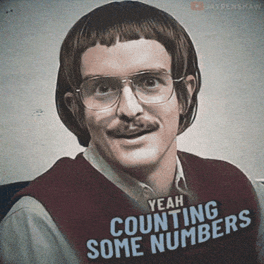 a man with glasses and a mustache is wearing a sweater that says yeah counting some numbers