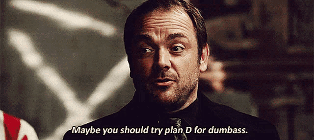 a man in a suit and tie says " maybe you should try plan d for dumbass "