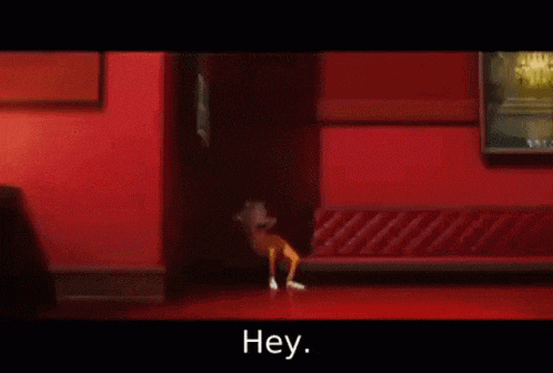 a person sitting on a red couch in a hallway with the words hey in white letters