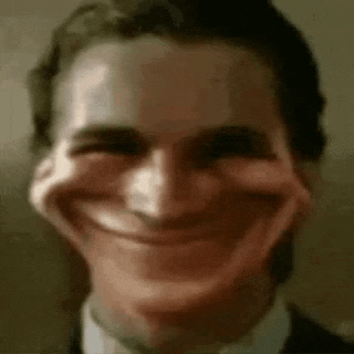 a close up of a man 's face with a fake smile on it .