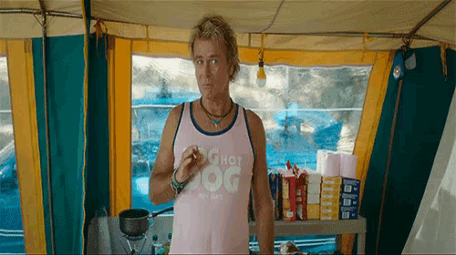 a man in a pink tank top that says the hot dog