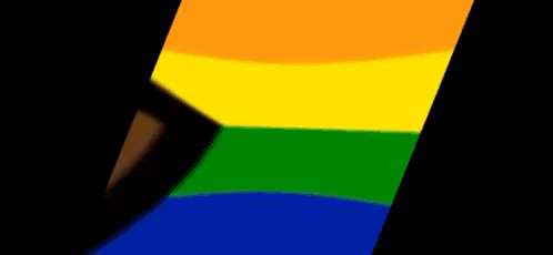 a close up of a rainbow flag with a black arrow in the middle .