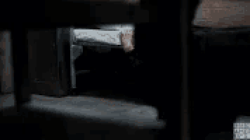 a woman with a scarf around her head is laying on the ground and says need a hand