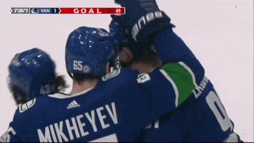 a hockey player with mikheyev on the back of his jersey celebrates a goal