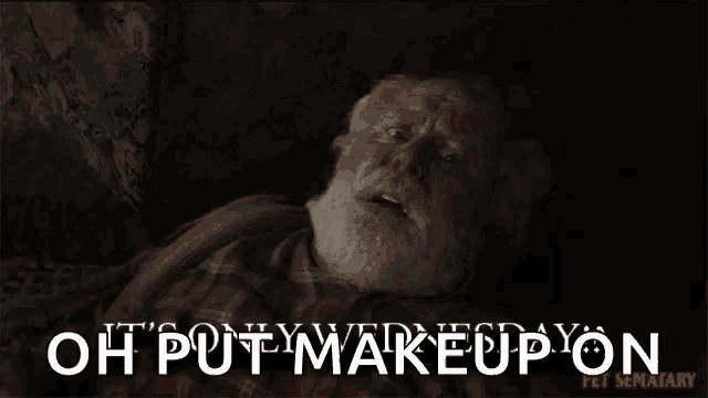 a man with a beard is laying down with the words oh put makeup on