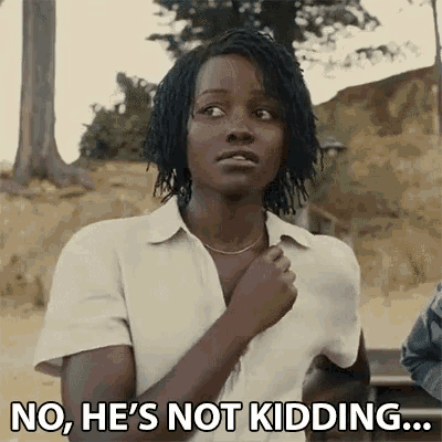 a woman in a white shirt is making a funny face and saying no , he 's not kidding .