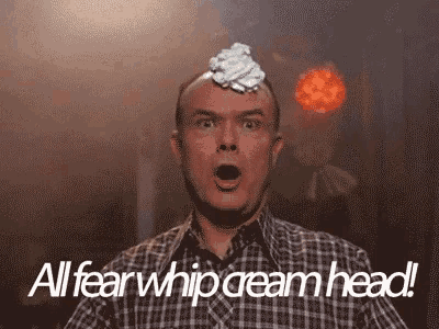 a man with whipped cream on his head and the words " all fear whip cream head " below him