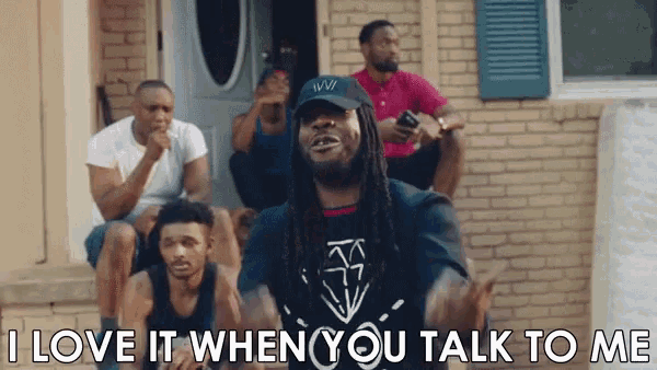 a group of men are sitting on a porch and one of them is saying i love it when you talk to me .