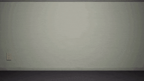 a bowling ball with a face on it is flying in front of a white wall