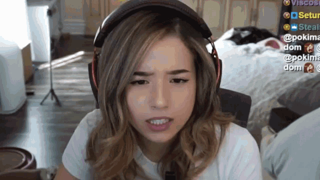 a woman wearing headphones and a white shirt is looking at the camera with the name pokima on the bottom right