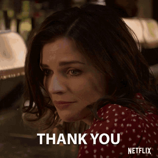a woman in a red dress says thank you on netflix