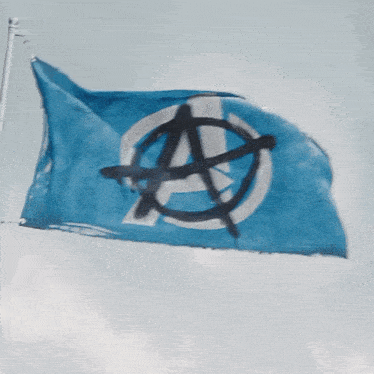a blue flag with an anarchy symbol in the middle