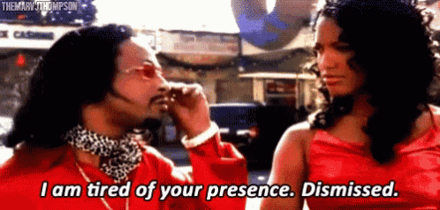a man in a red shirt is talking to a woman in a red dress who is tired of his presence