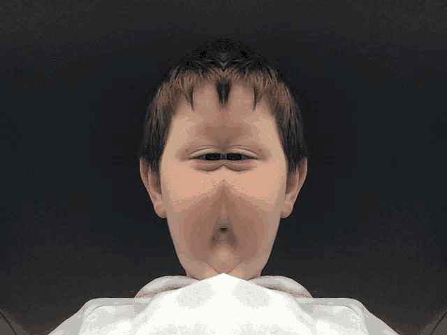 a close up of a person 's face with a cartoon face