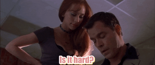 a man and a woman are standing next to each other with the words is it hard written on the bottom
