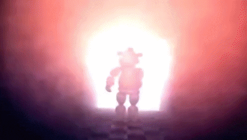 a silhouette of a teddy bear is standing in front of a bright light in a dark room .