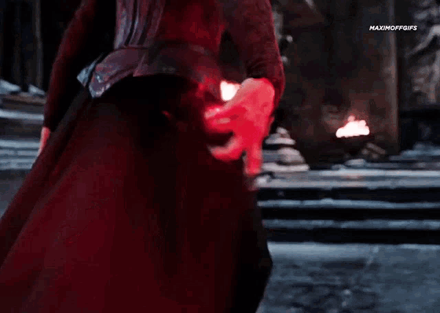 a close up of a person holding a red light .