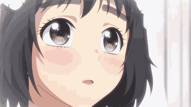 a close up of a girl 's face with a flower on her head
