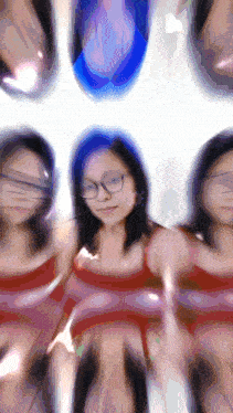 a blurry picture of a woman with glasses and a red top