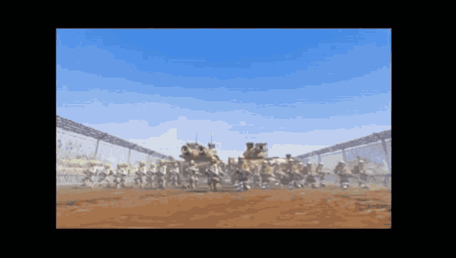 a group of soldiers are standing in the dirt in front of a fence