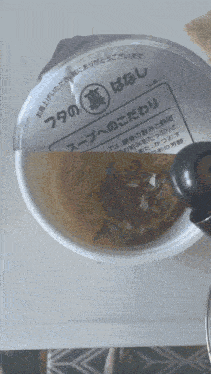 a cup of soup with a label that says ' no. 20 ' on it