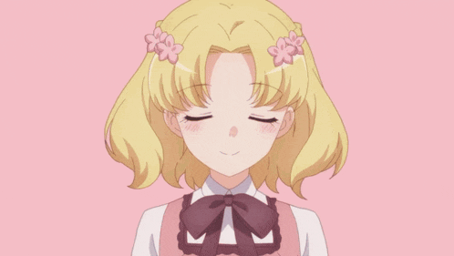 a girl with blonde hair and blue eyes is wearing a bow tie and flowers in her hair
