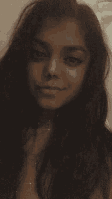 a close up of a woman 's face with long hair