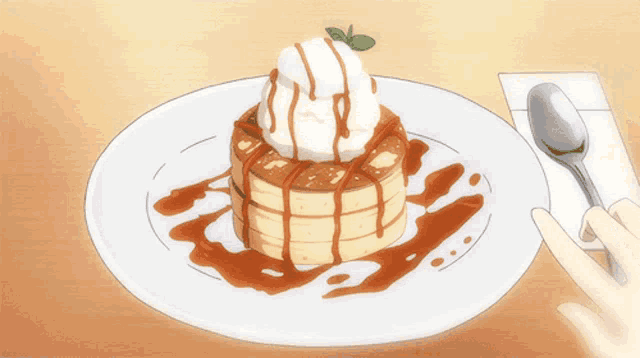 a pancake with whipped cream and caramel sauce on top