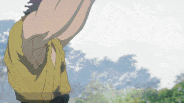 a person in a yellow shirt is standing in the woods